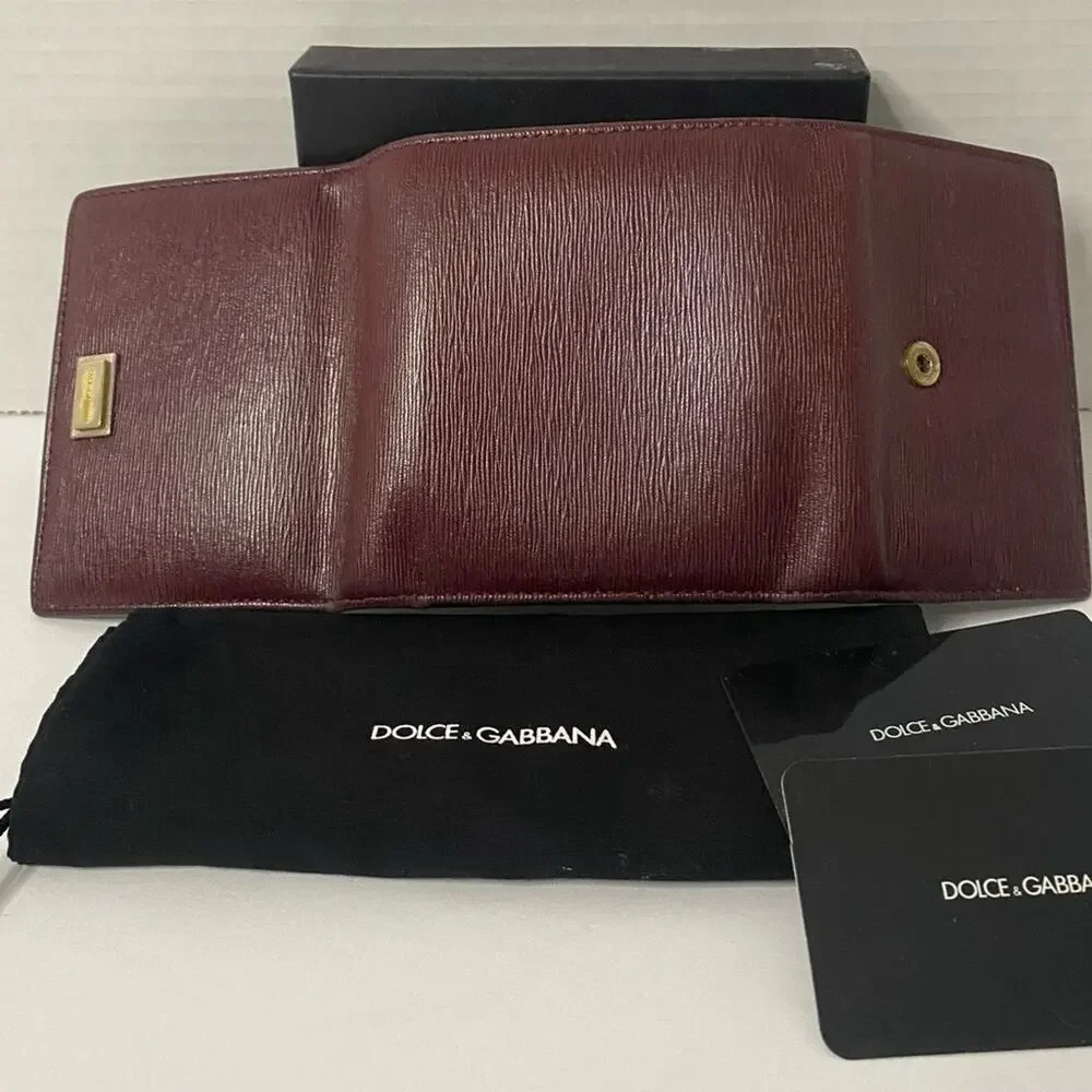 Dolce & Gabbana  burgundy 2 fold wallet with change section signature on front